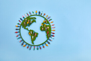 World Population Day, creative concept. Large and diverse group of people in the shape of the world map
