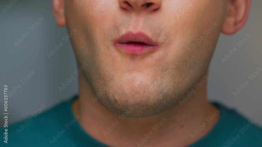 Portrait of Young Man Eating Healthy Food on Camera Close Up. Crop Face of Modern Sports Person Enjoying Cereal Bar and Relaxing. Normal Appetite of Hunger Guy with Muesli Treat in Casual Studio Shot Portrait of Young Man Eating Healthy Food on Camera Close Up. Crop Face of Modern Sports Person Enjoying Cereal Bar and Relaxing. Normal Appetite of Hunger Guy with Muesli Treat in Casual Studio Shot