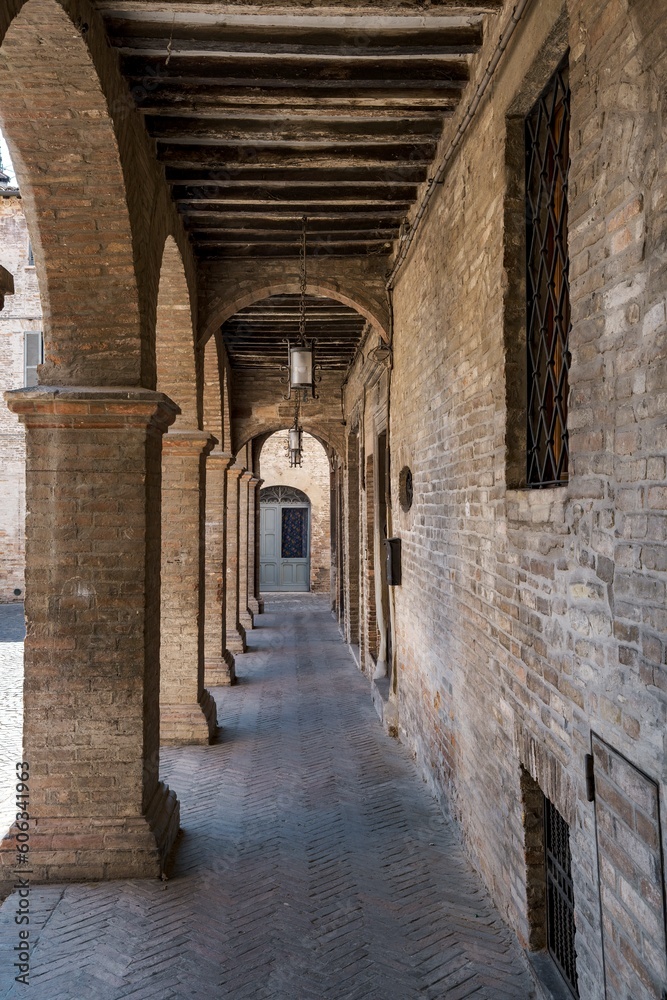 The ancient arcades of the medieval village of Urbania in the Marche region of Italy