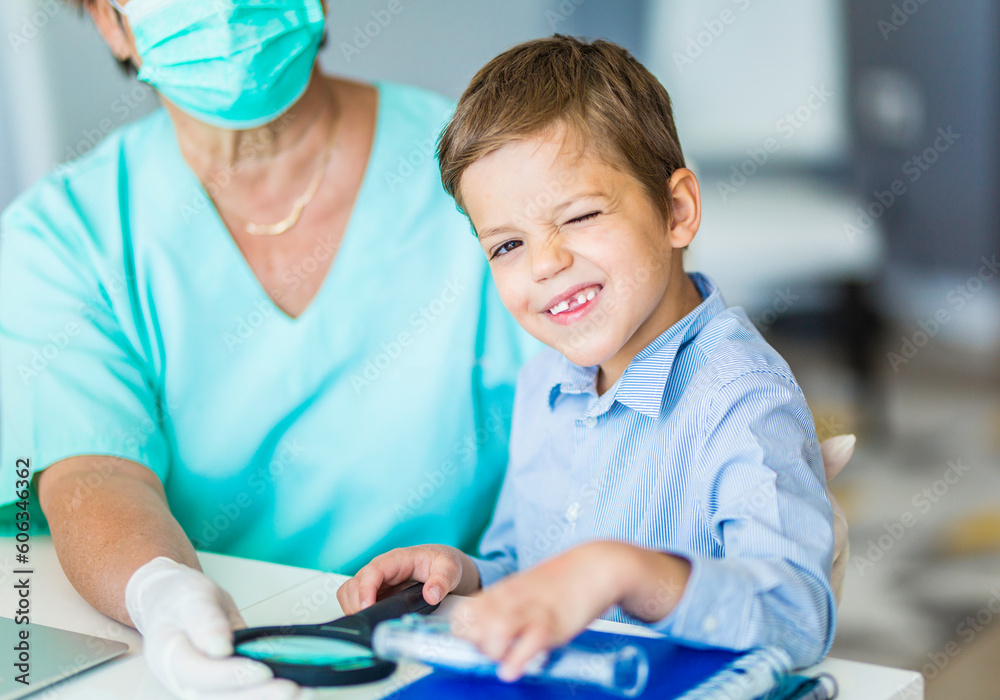 Little boy at the doctors office smiling at the camera