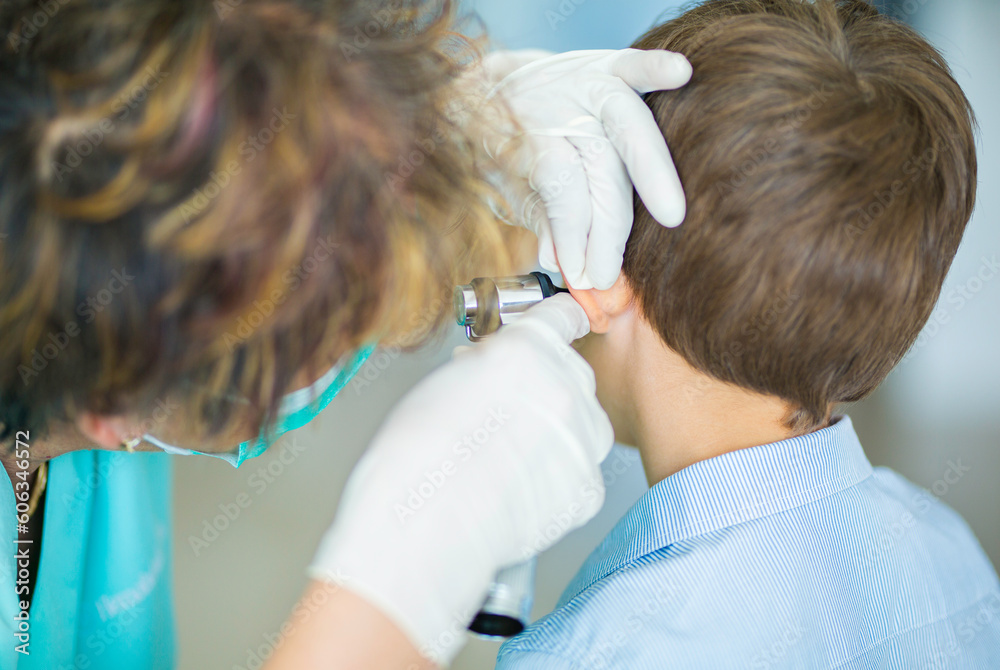 Little boy getting his ears checked Little boy getting his ears checked