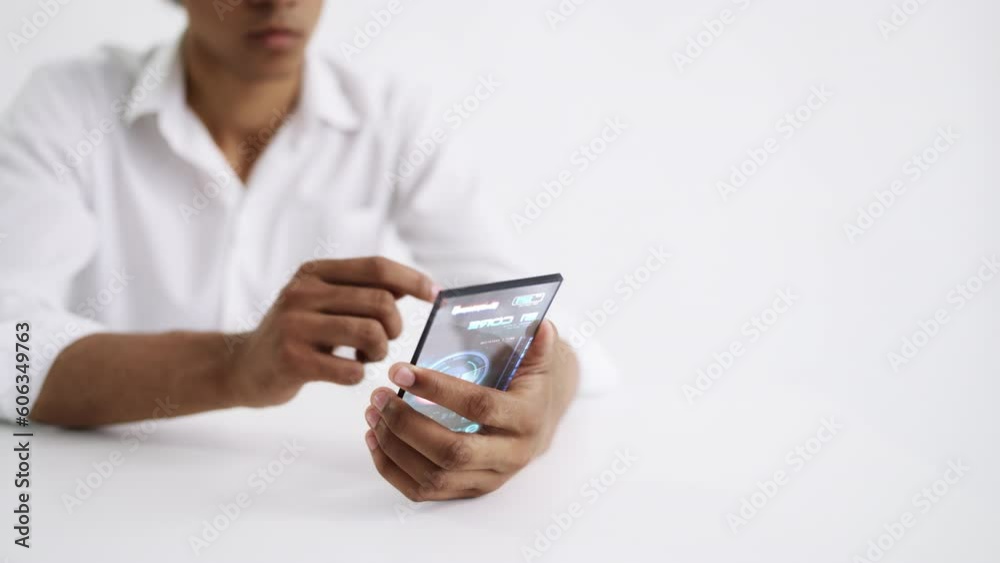 IT specialist working on smartphone with holographic screen, high end tech. Futuristic technology on white background IT specialist working on smartphone with holographic screen, high end tech. Futuristic technology on white background