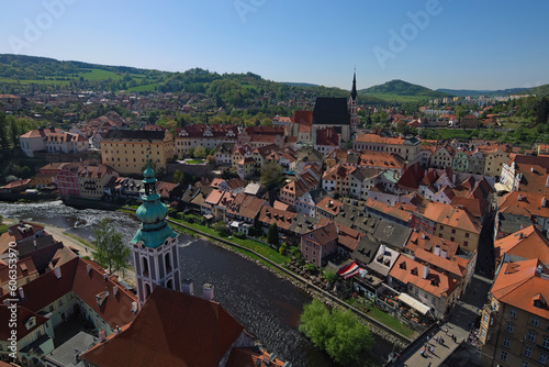 Wide-angle aerial landscape view of old town of Cesky Krumlov (Krumau). Famous czech historical beautiful town. Vintage colorful buildings with red tile roof. UNESCO World Heritage Site
