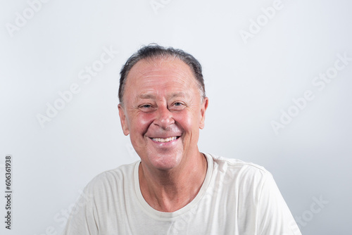 Portrait of smiling Serious middle-aged man on white background. © chotiga