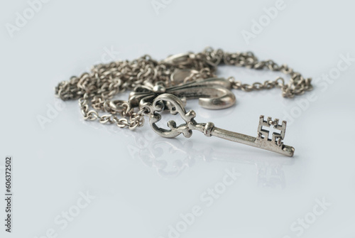 Key on a chain on a light background