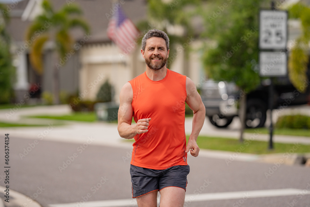 Sport runner. Man running. Fit male sport fitness model sprinting outdoors. Attractive man running fast, workout outdoors, runner jogging over american street. Sport runner. Man running. Fit male sport fitness model sprinting outdoors. Attractive man running fast, workout outdoors, runner jogging over american street.
