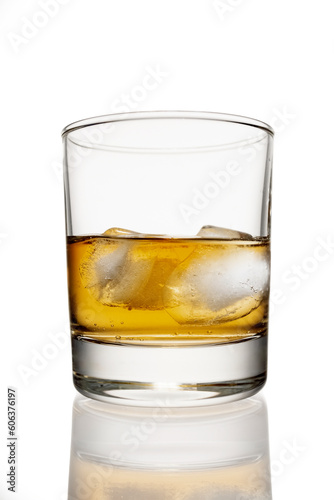 clean whiskey glass isolated on white background with a clipping path. Strong alcoholic cocktail with ice in a low glass isolated on white background