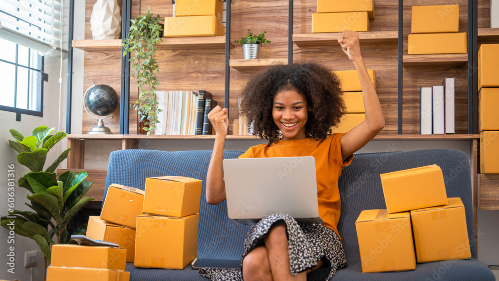 Φωτογραφία African American business woman working at warehouse preparing SME package box for delivery at small business home office