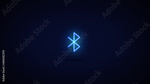 Animated, glowing bluetooth icon successfully connecting to device against a black background photo