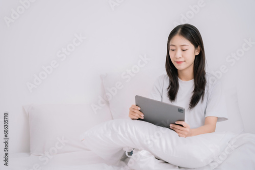 Women are using tablet to work  in the morning.