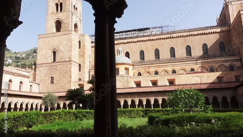 Palermo, ancient Monreale Cathedral cloister, courtyard columns, in summer. Medieval byzantine cloister. Monreale, Palermo, Italy