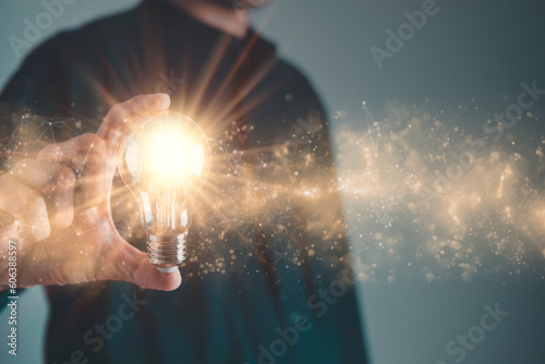 Business man holding light bulb. New idea, innovation technology and creative concept.
