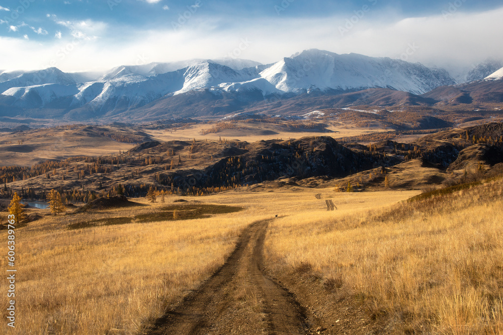 Autumn landscape with views of mountains, forest, road, steppe, river, lake, yellow leaves and trees Autumn landscape with views of mountains, forest, road, steppe, river, lake, yellow leaves and trees