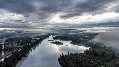 Aerial shot of a river under a cloudy sky in Invermere, BC, Canada.