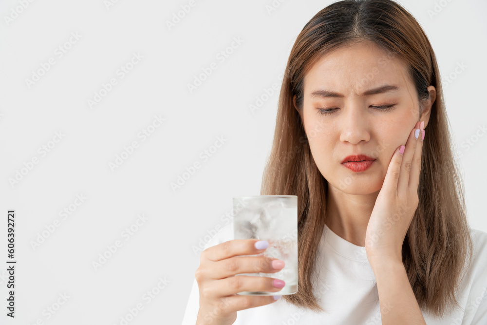 Asian woman feel sensitive teeth after drinking cold, female suffer tooth, decay problems, dental care, tooth extraction, decay problem, bad breath, Gingival Recession, Oral Hygiene instruction Asian woman feel sensitive teeth after drinking cold, female suffer tooth, decay problems, dental care, tooth extraction, decay problem, bad breath, Gingival Recession, Oral Hygiene instruction