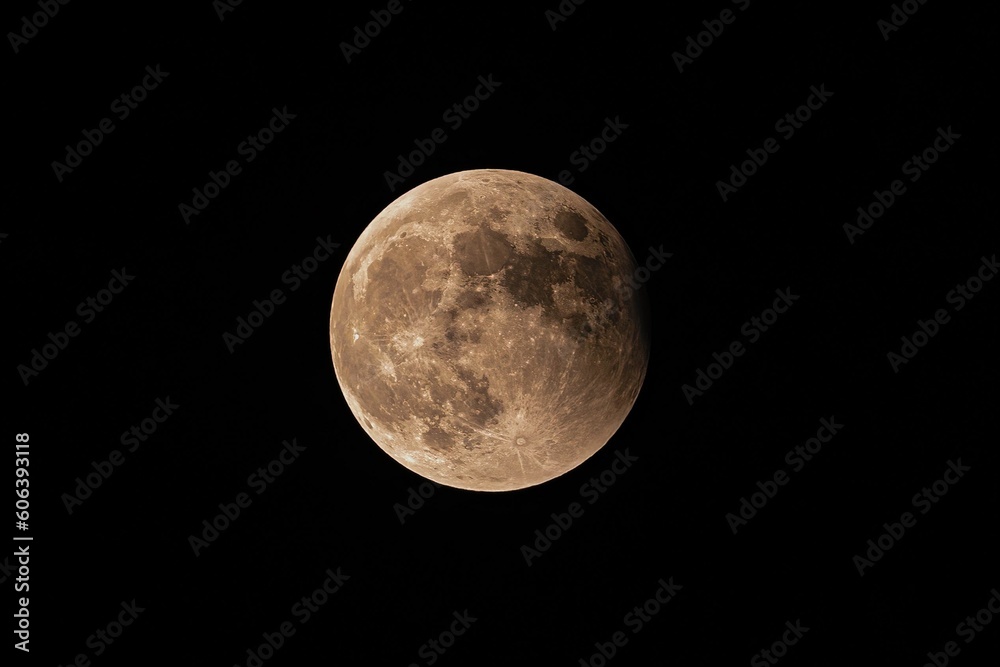Fototapeta premium Scenic view of Lunar Eclipse isolated on a black background