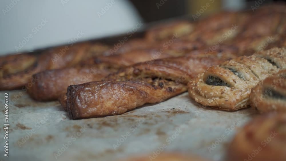 various exciting pastries are sorted on a baking tray in a bakery various exciting pastries are sorted on a baking tray in a bakery