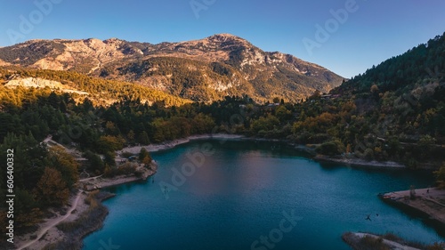 Landscape of the beautiful Tsivlos Lake with green vegetation at the shore, Greece