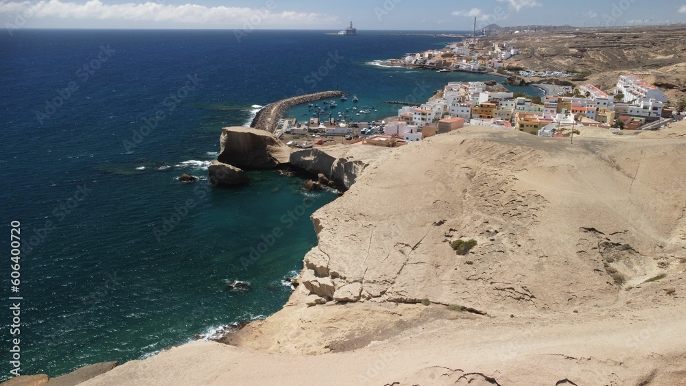Drone shot of San Miguel de Tajao town with fishing port in Tenerife, Canary Islands