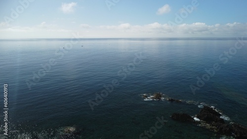 Aerial view of a rocky coast and a blue sea