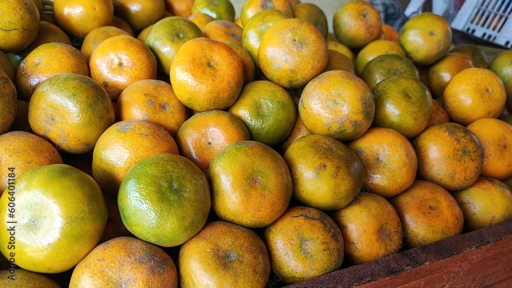 Yellow oranges are neatly arranged on the table Yellow oranges are neatly arranged on the table