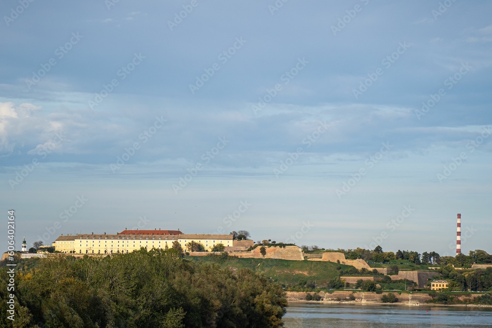 Sat Na Petrovaradinskoj Tvrdjavi with a lake view on a sunny day, cloudy sky in the background Sat Na Petrovaradinskoj Tvrdjavi with a lake view on a sunny day, cloudy sky in the background
