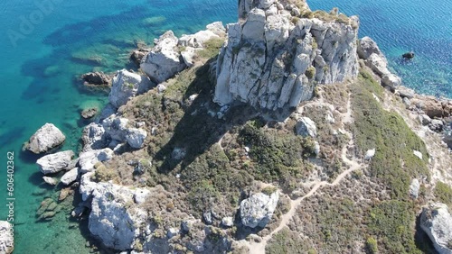 Aerial view of a turquoise sea water surrounded by huge cliffs photo