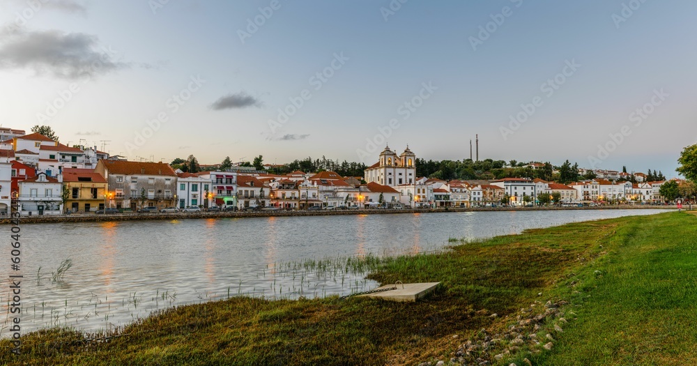 Beautiful landscape over the riverside area of Alcacer do Sal, Portugal with buildings on the shore