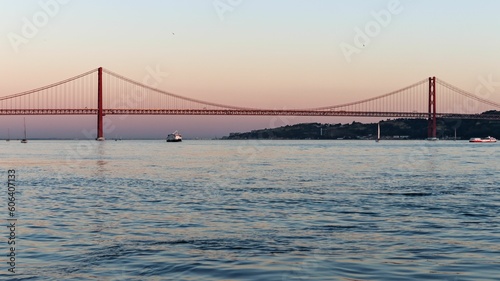 View of 25 de Abril Bridge at sunset. Lisbon, Portugal.