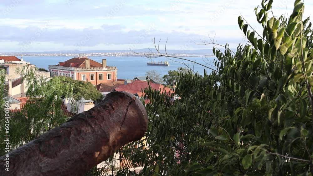 Scenic aerial view of Lisbon city against the Tagus river with a sailing ship Scenic aerial view of Lisbon city against the Tagus river with a sailing ship