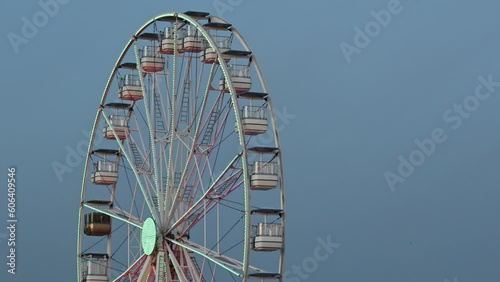 Landscape shot over populated Cascais bay with Ferris wheel view at blue hour