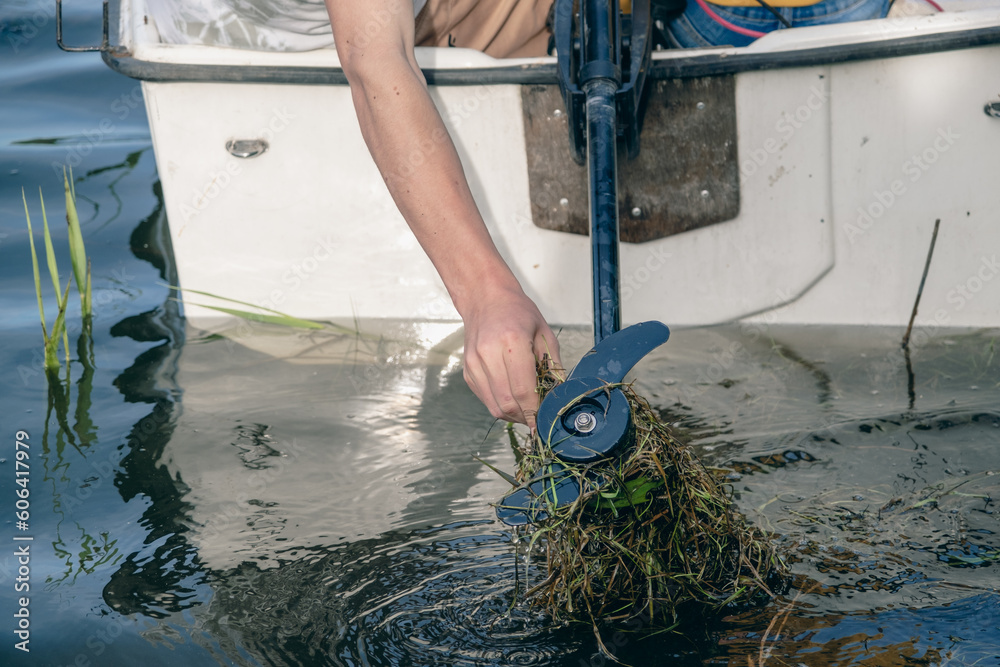 Foto de Boat engine failure boat propulsion, plants twisted into a