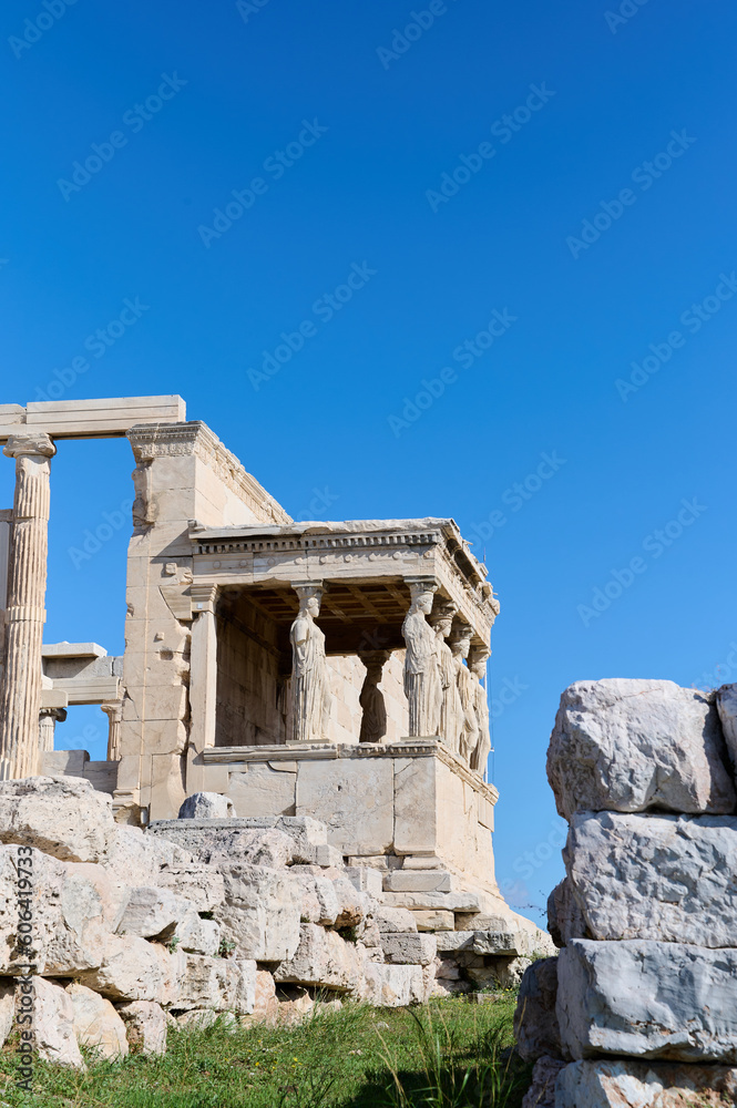 Ancient temple Parthenon in Acropolis Athens Greece on a bright blue sky background. The best travel destinations. Vertical photo.
