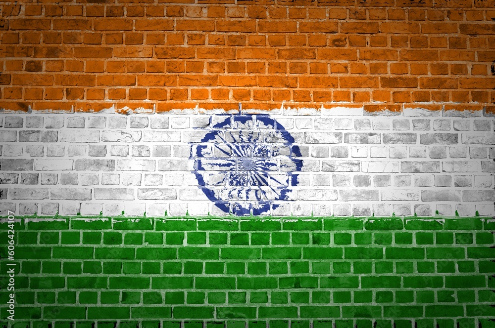 Shot of the India flag painted on a brick wall in an urban location