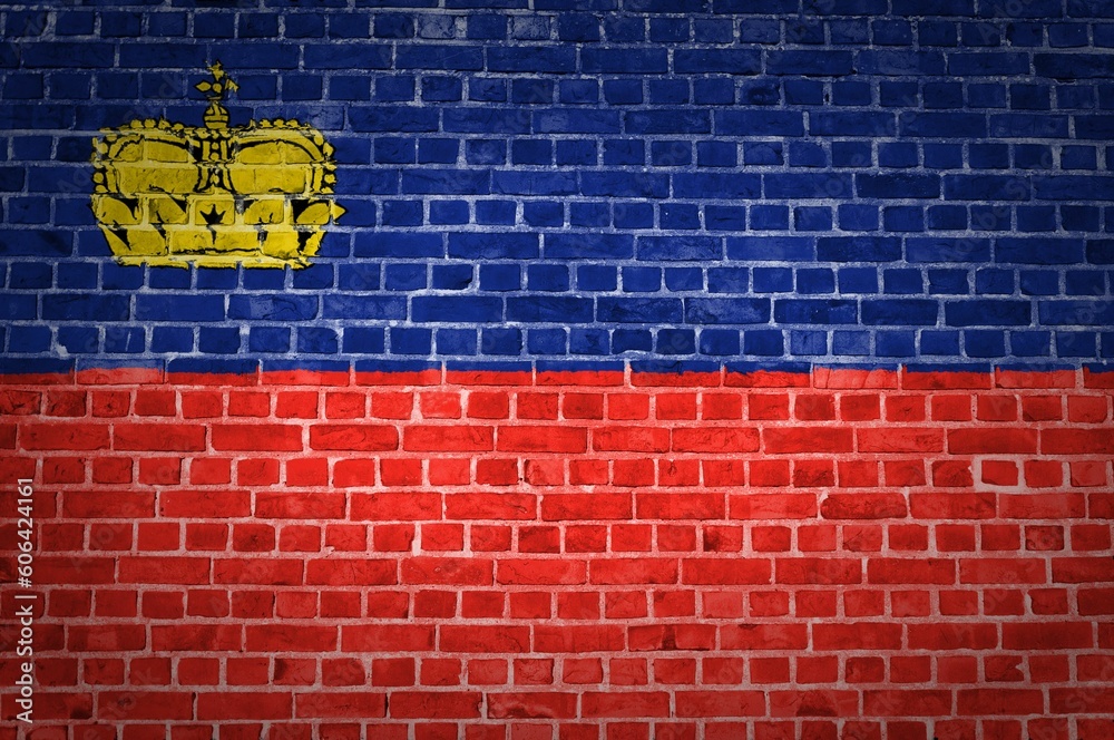 The Liechtenstein flag painted on a brick wall in an urban location The Liechtenstein flag painted on a brick wall in an urban location