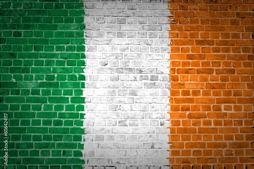 The Ireland flag painted on a brick wall in an urban location