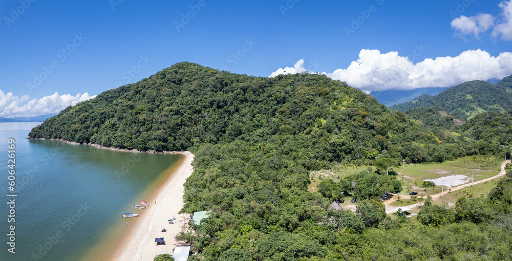 Aerial drone view of beautiful beach and forest trees of mata atlantica biome in sunny summer day. Paraty, Rio de Janeiro, Brazil. Concept of vacations, travel, holiday, tourism, idyllic landscape.