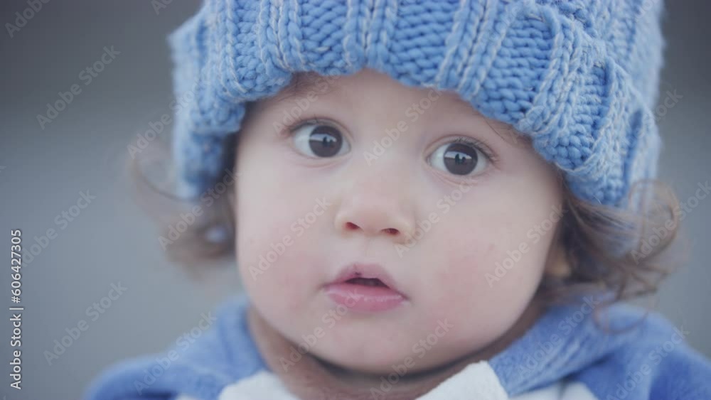 Young toddler boy looks to the camera adorably Young toddler boy looks to the camera adorably