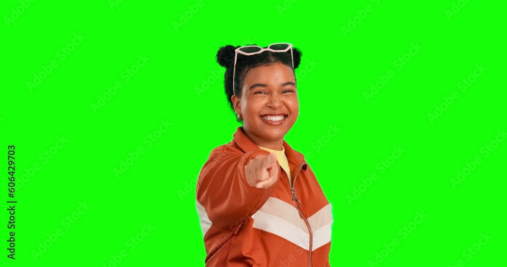 Woman, hand pointing and face with green screen and happiness with selection. Happy, isolated and studio background with a young female model with choice and emoji hands gesture with a smile Woman, hand pointing and face with green screen and happiness with selection. Happy, isolated and studio background with a young female model with choice and emoji hands gesture with a smile