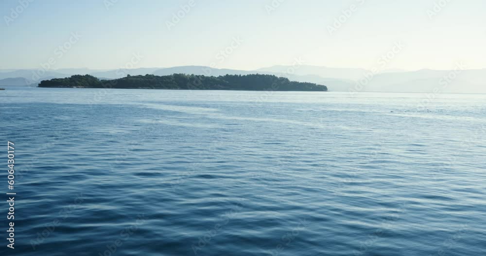 Abandoned island in sea with calm water waves moving in slow motion. Travel concept background Abandoned island in sea with calm water waves moving in slow motion. Travel concept background