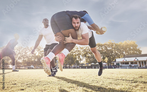 Sports, rugby and men tackle for ball on field for match, practice and game in tournament or competition. Fitness, teamwork and sport players playing for exercise, training and performance to win