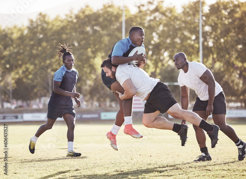 Sports action, rugby and men on field for match, practice and game in tournament or competition. Fitness, teamwork and players tackle for exercise, training and performance for winning ball to score