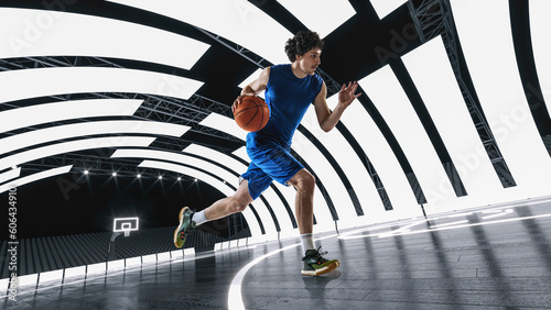 Fotografia Young man in blue uniform, basketball player in motion, dribbling ball at 3D basketball arena, court with lights