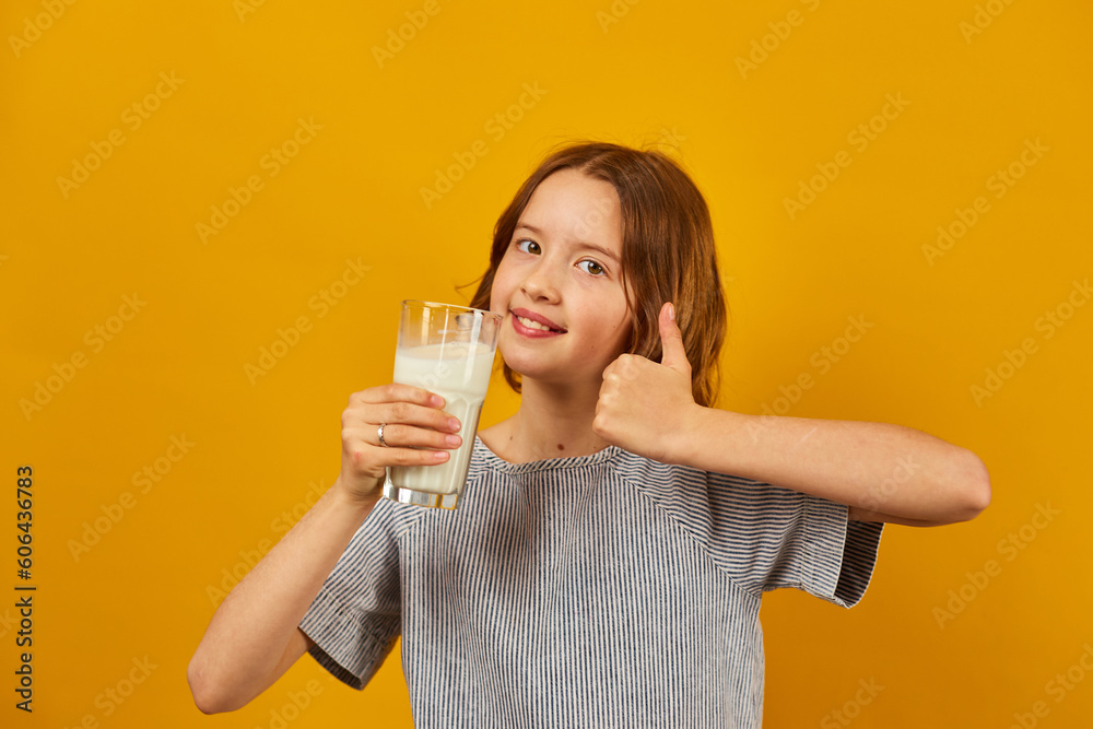 Pretty teen girl, child with a fresh glass of milk Pretty teen girl, child with a fresh glass of milk