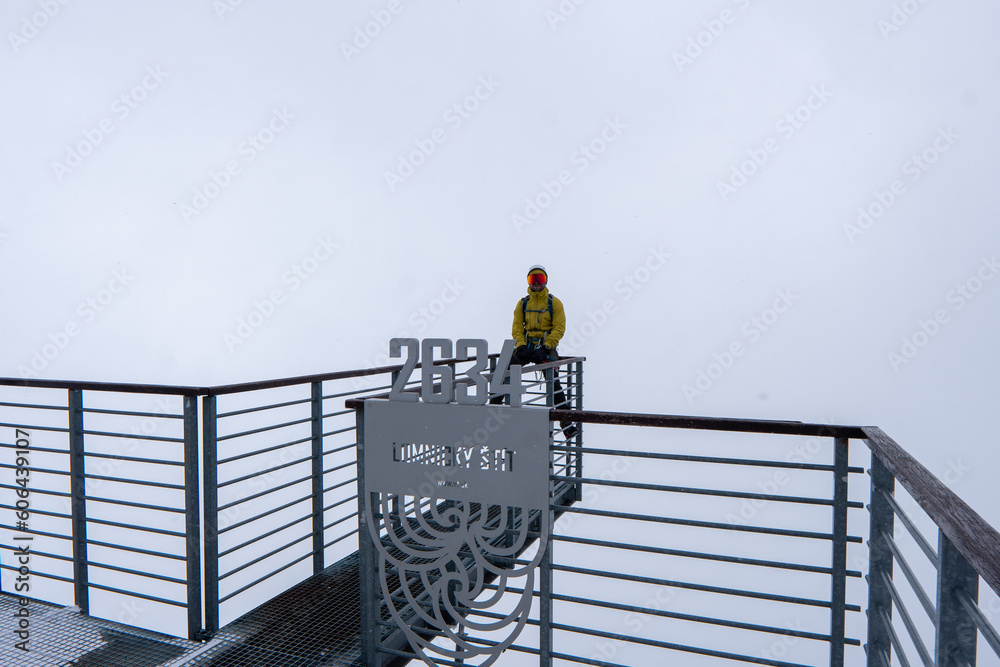 Snowy walkway across High Tatra Mountain ridge in winter, Lomnicky Peak Stit, Slovakia Man on Top