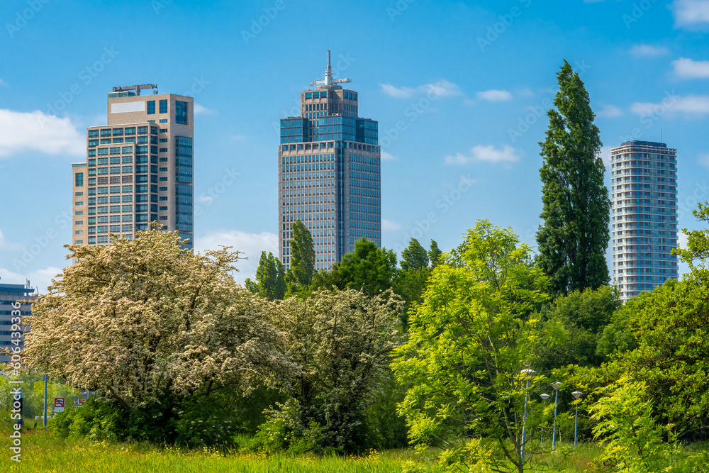Φωτογραφία Office buildings, Rembrandt Tower in Amsterdam seen from the park on a sunny spr