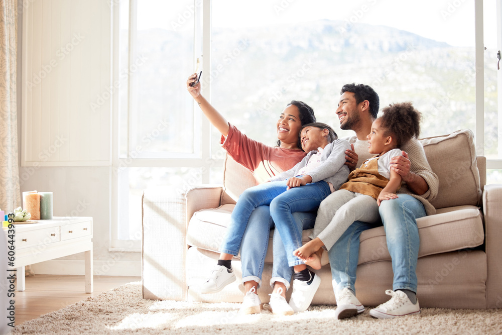Parents, children and sofa selfie with smile, happiness and bond in lounge for social media app. Father, mother and daughters with care, love and together for profile picture, blog and happy on couch Parents, children and sofa selfie with smile, happiness and bond in lounge for social media app. Father, mother and daughters with care, love and together for profile picture, blog and happy on couch