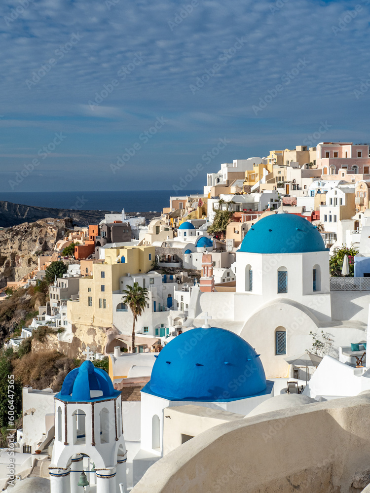 Fototapeta premium Iconic views of blue domes and white buildings in Santorini, Greece