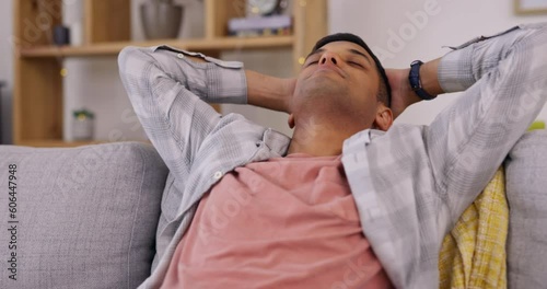 Man, relax and stretching on sofa in home for happiness, calm mind and easy life for stress relief in living room. Young guy, breathe and enjoy peace on couch, mindset and self care for mental health photo