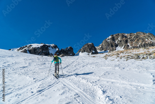 Ski touring in high alpine landscape with snowy trees. Adventure, winter activities, skitouring in spectacular mountains, Tatras mountain in Slovakia and poland Europe